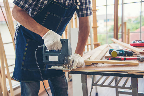 istock DIY craftsperson asian man working wood heap carpenter objects woodwork desk. Architect man hands use ruler measure hammer home improvement. Wooden builder carpenter repairing construction workshop 2222080892