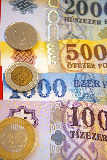istock Hungarian forint banknotes and coins close up. 2222082562