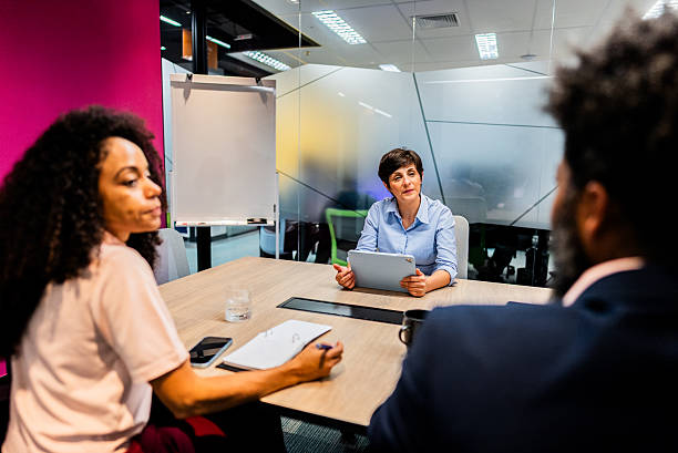 istock Coworkers talking on the office 2222083615