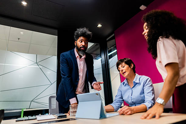 istock Coworkers talking on the office 2222083669