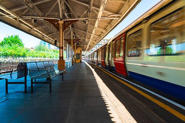 London underground train arriving at a station platform