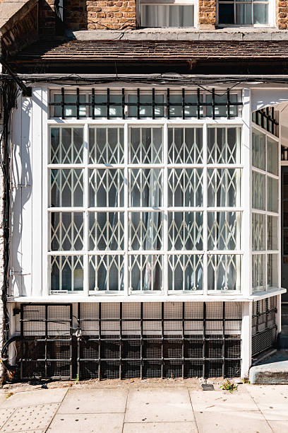 istock White retractable security gates protecting shop window in london 2222085734