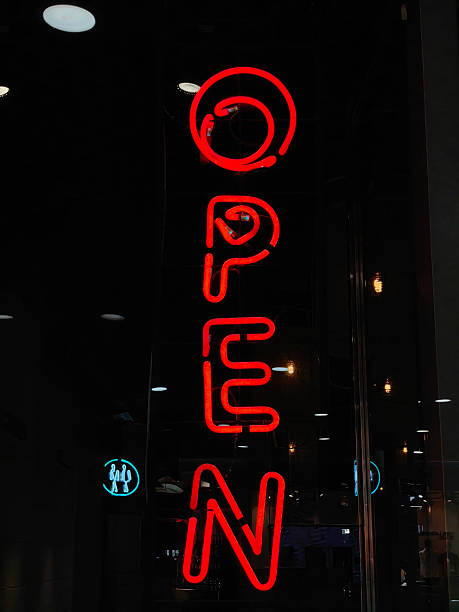 istock bright red neon sign indicating open status for a store featuring evening hours. closeup. 2222085950