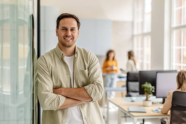 istock Professional young adults engaged in various tasks in a modern office setting 2222086608