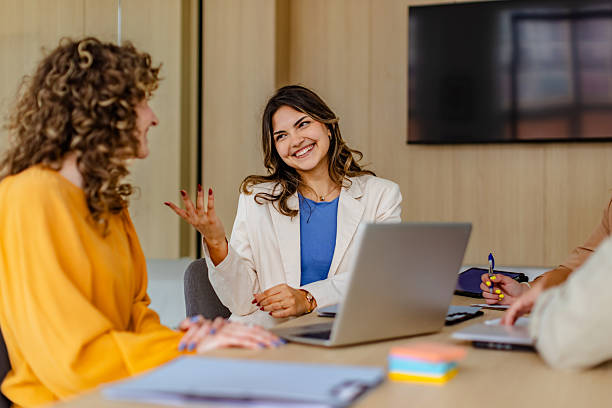 istock Young adults engage in collaboration during a meeting in a modern office setting 2222091865