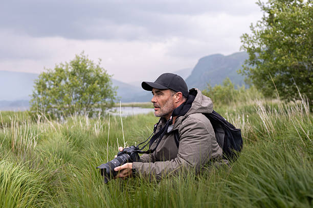 Wildlife Photographer Hiding in Tall Grass
