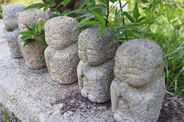 Small Jizo statues lined up in a row