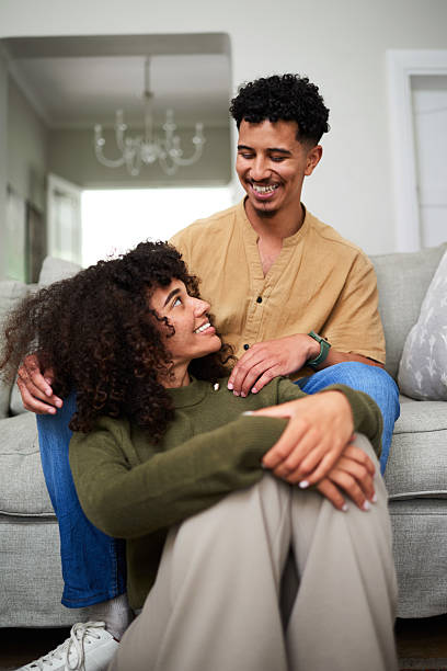 istock Happy Couple Relaxing Together in Comfortable Home Environment 2222099987