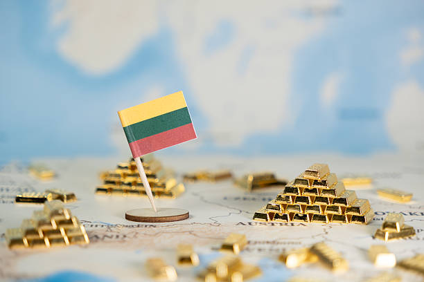 istock Lithuanian flag positioned on a global map, surrounded by golden bar piles, symbolizing national wealth, economic stability, and strategic financial reserves 2222103144