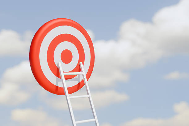 istock Ladder reaching a red and white target against a cloudy sky. 3d rendering 2222104517