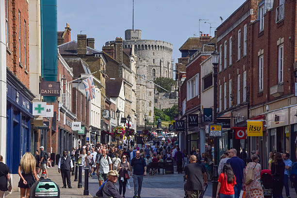 Windsor, UK - September 1 2024: people walk long Peascod Street with a view of Windsor Castle.