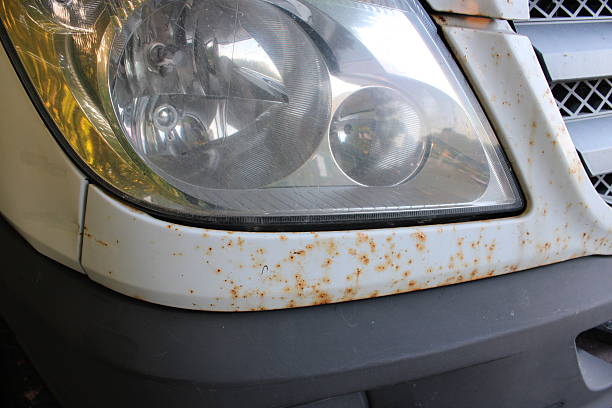 istock Close-Up View of Rust Spots on a White Metal van 2222108155