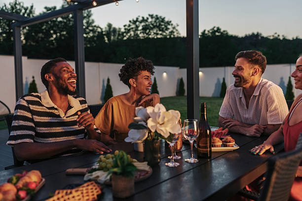 istock Friends enjoying dinner together on a summer evening 2222109238