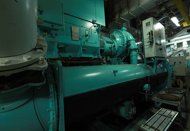 istock Cruise ship engine room interior with water tight doors electrical and diesel engines, water pipes, measuring instruments, diesel engines 2222109726