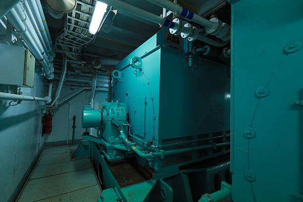 istock Cruise ship engine room interior with water tight doors electrical and diesel engines, water pipes, measuring instruments, diesel engines 2222109767