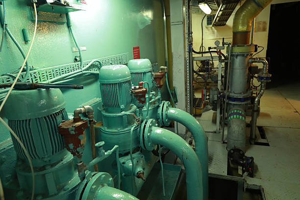 istock Cruise ship engine room interior with water tight doors electrical and diesel engines, water pipes, measuring instruments, diesel engines 2222109966