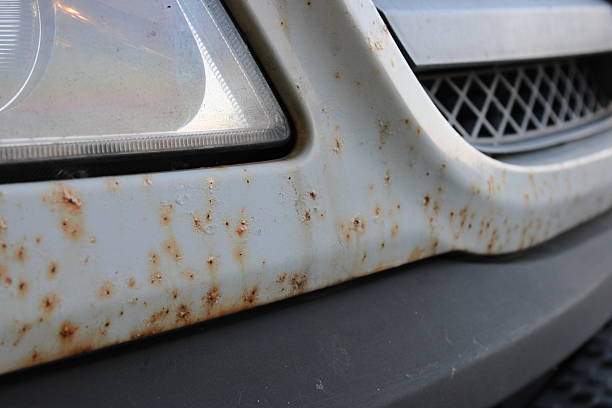 istock Close-Up View of Rust Spots on a White Metal van 2222110189