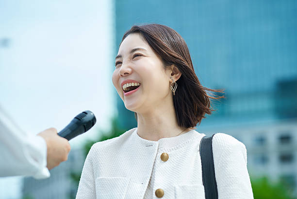 istock A young woman being interviewed outdoors 2222110802