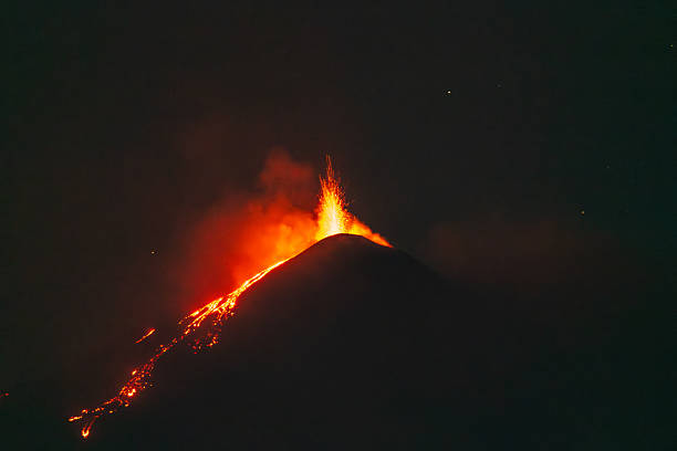 istock Lava fountain and glowing flows at night 2222111057