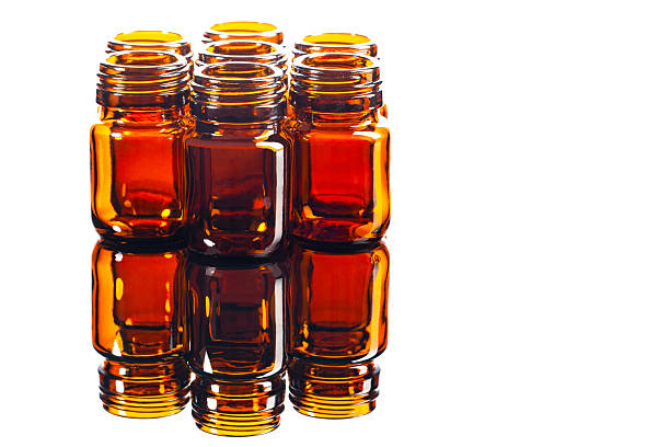 A group of cylindrical glass vials,used especially for holding medicines,on white background.