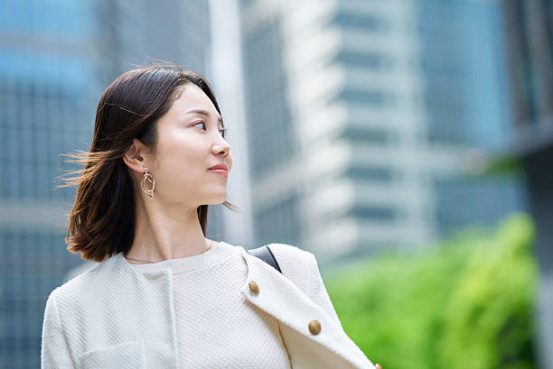 istock A woman commuting in a business district 2222111429