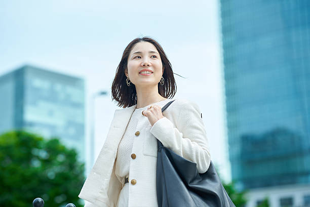 istock A woman commuting in a business district 2222111494