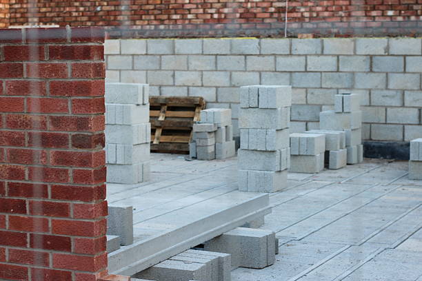 New building under construction, half built external walls with no people