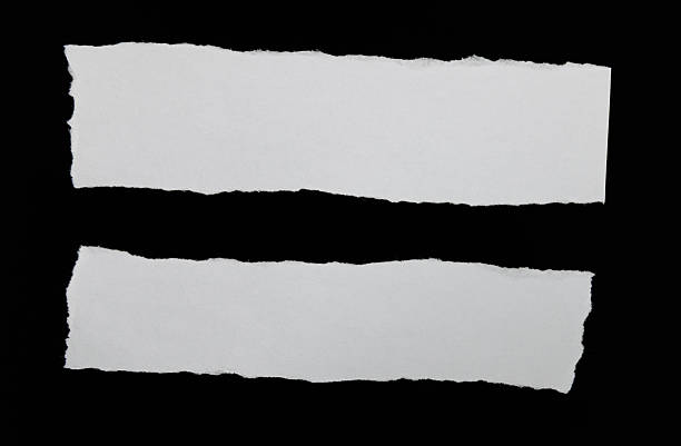 istock Pieces of torn paper on black background 2222113200
