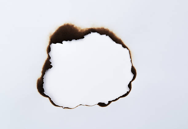 The white paper was burned with hole
