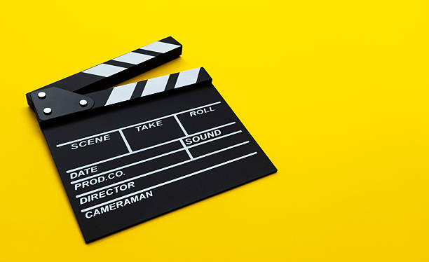 istock Film slate on yellow background 2222114004