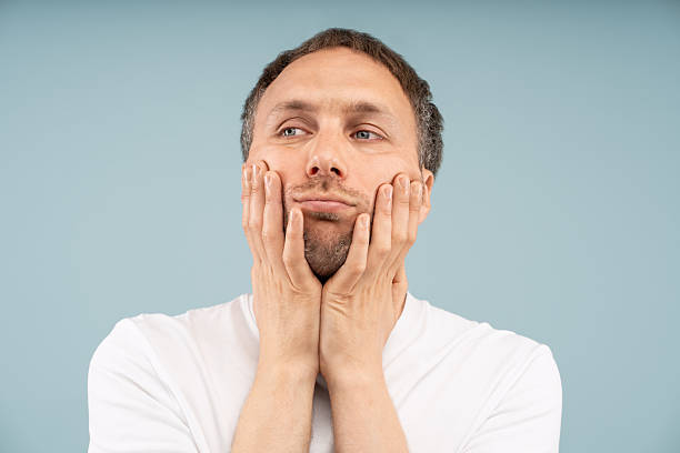 Depressed man lost in thought feels apathy by existential crisis, chronic stress, societal pressure.