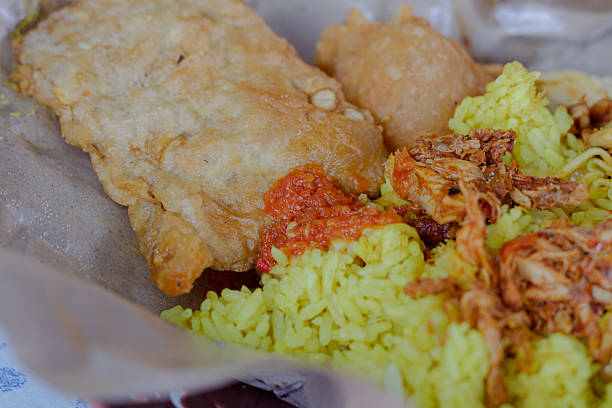 istock Traditional Yellow Rice dish Nasi Kuning served with various side dishes 2222119377