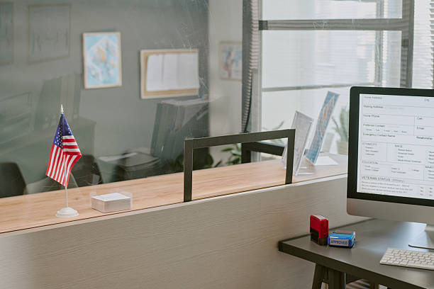 istock Office Desk with Computer and American Flag Displayed 2222119525