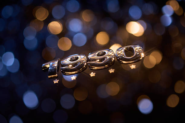 Shiny chrome “1990” numbers are displayed with glowing star accents against a soft blue and gold bokeh background, evoking a nostalgic, festive mood perfect for retro-themed celebrations, decade commemorations, or vintage party visuals.