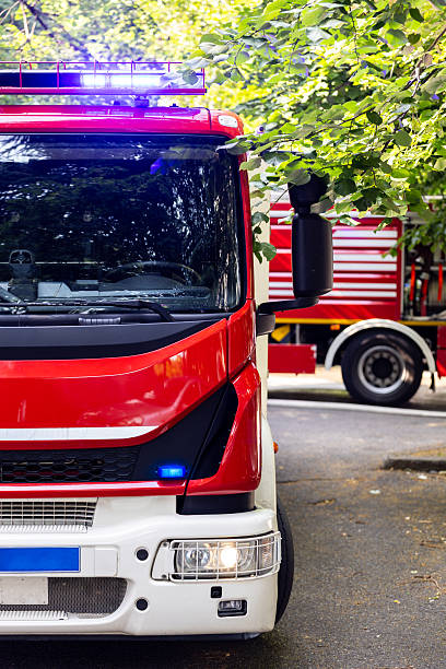 istock Emergency response vehicle parked on a tree-lined street during daytime rescue operation 2222131402