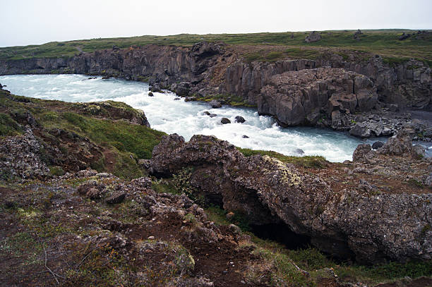 Powerful river flows through canyon with dramatic rock formations