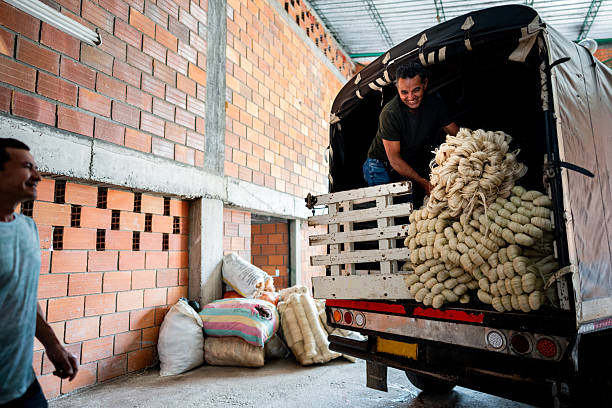 istock Mature man unloading truck with wool at textile industry 2222134187