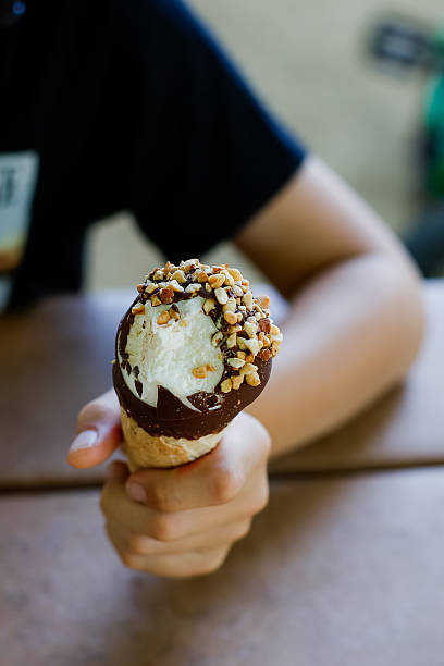 Child eating dipped  ice cream cone