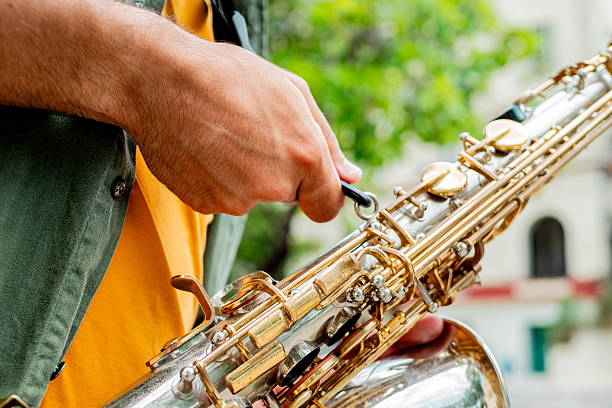 Close-up of man holding saxophone