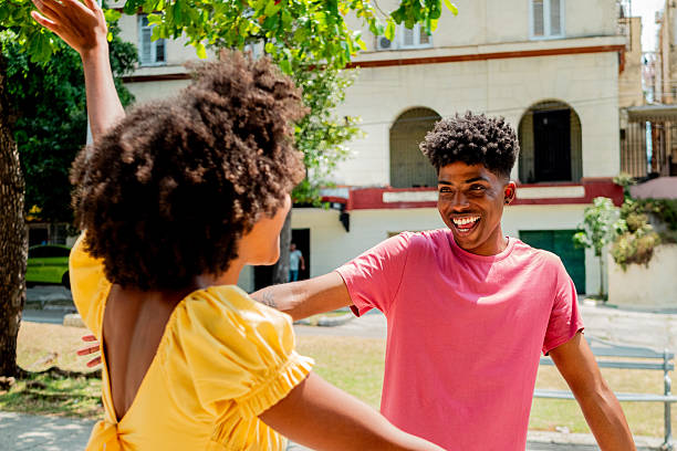 istock Young friends greeting outdoors 2222135904