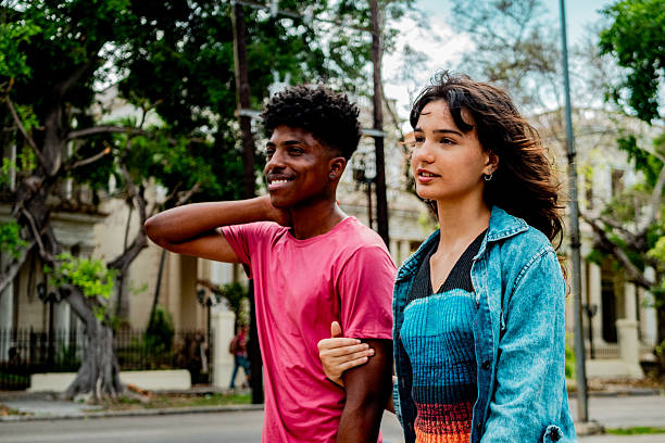 istock Couple talking and walking on the city 2222136175