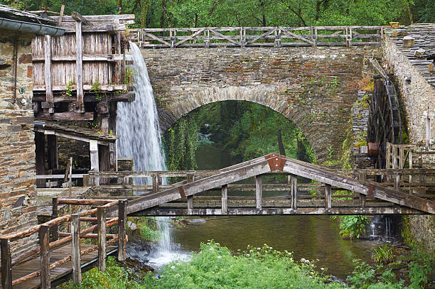 Taramundi, Spain 29 May 2016 - Cascading water animates the historic Mill Museum of Mazonovo in Taramundi, Asturias.