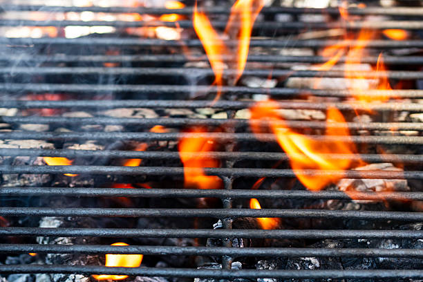BBQ grill with burning wood and fire flames. Empty hot charcoal barbecue grill with bright flame