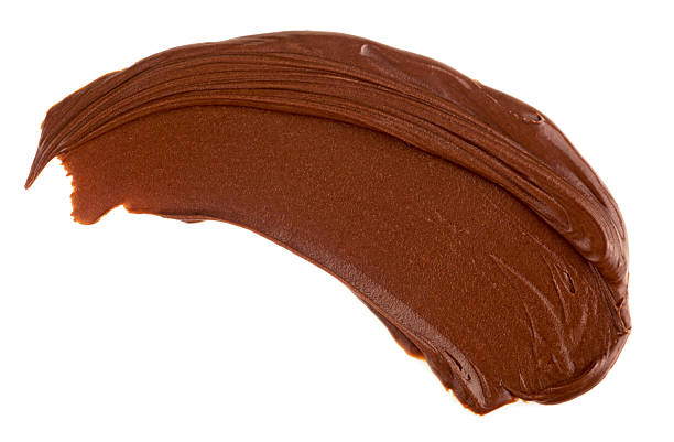 istock Chocolate hazelnut cream isolated on a white background, top view. Chocolate cream swirl, chocolate smear, melted chocolate. 2222141795