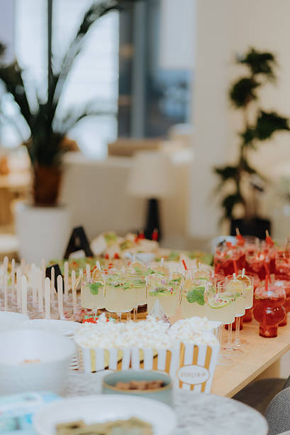 istock Catering service preparing cocktails, popcorn and appetizers for party 2222142973