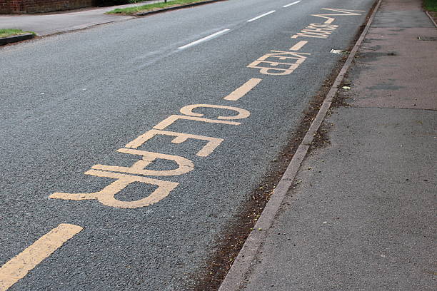 istock Yellow road markings painted on main road School Keep Clear 2222145116