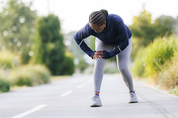 istock A runner is experiencing knee pain during outdoor exercise 2222145386