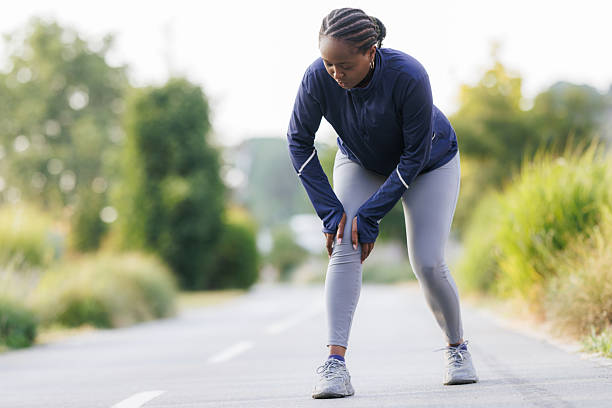istock A young woman is feeling knee pain after a running session 2222145391