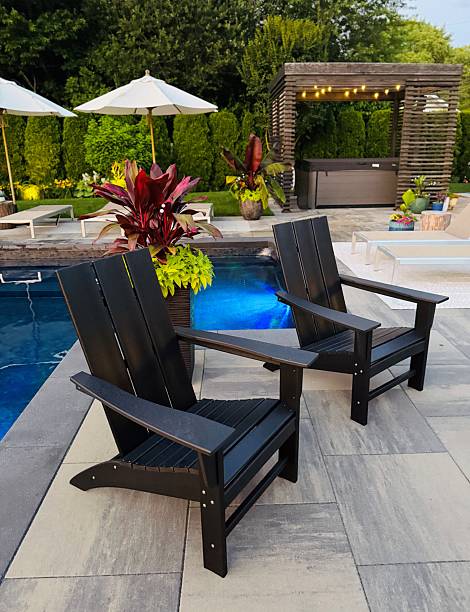 istock Beautiful, luxury, modern backyard lounge area with umbrella and lounge chairs poolside. 2222148185