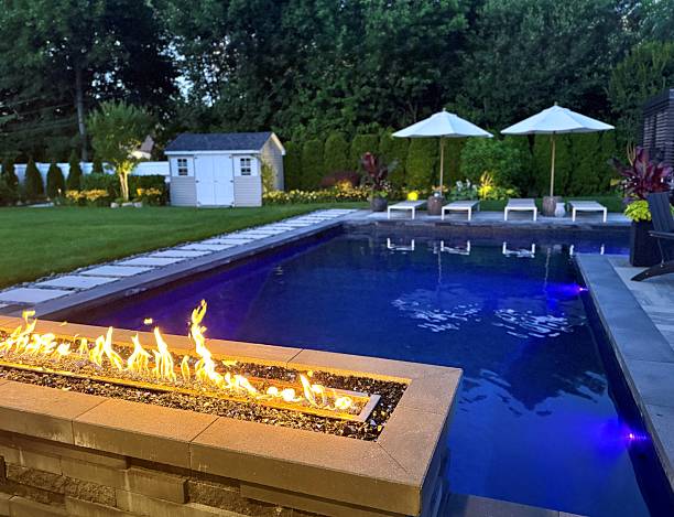 istock Gorgeous sunset backyard living space.  All Season - year round. Fire pit with cascading waterfall. 2222148192